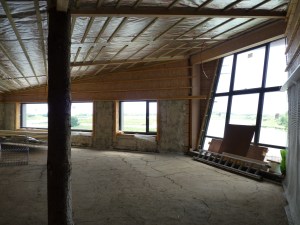 inside Huxley Visitor centre under construction, the packed earth floor